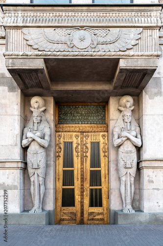 Beautiful wooden door with carving decorated in egyptian style and ornaments.