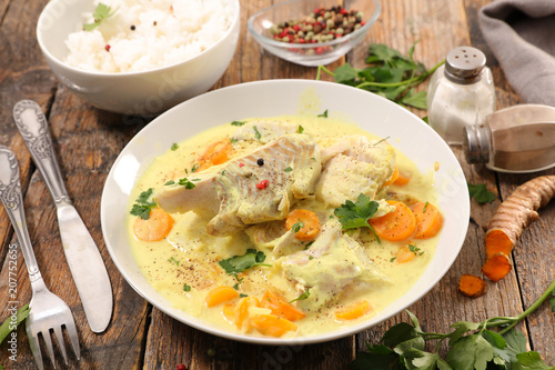 Photography fish stew with cream and carrot