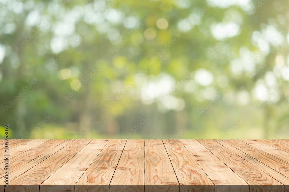 Empty wood table on blurred background copy space for montage your product or design,Blank brown board with abstract blurred background. Empty wood table on blurred background copy space for montage your product or design,Blank brown board with abstract blurred background.
