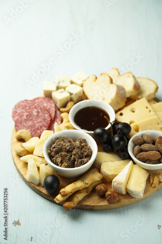 Assorted appetizers on desk. Cheeses  pate  honey  nuts