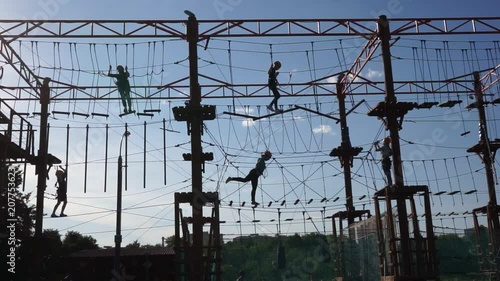 Children are playing in a rope park