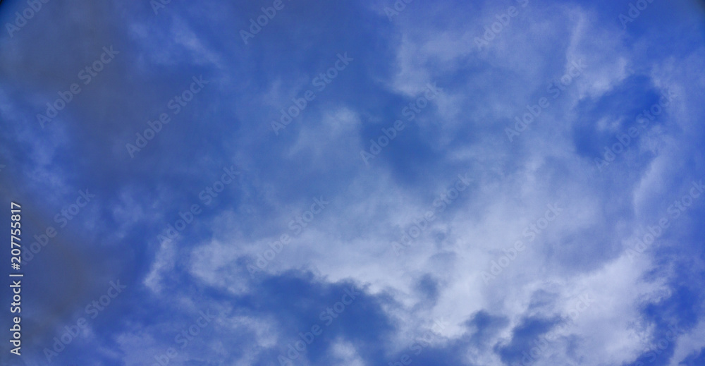 Blue sky with white clouds background;
