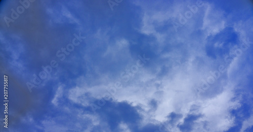 Blue sky with white clouds background;