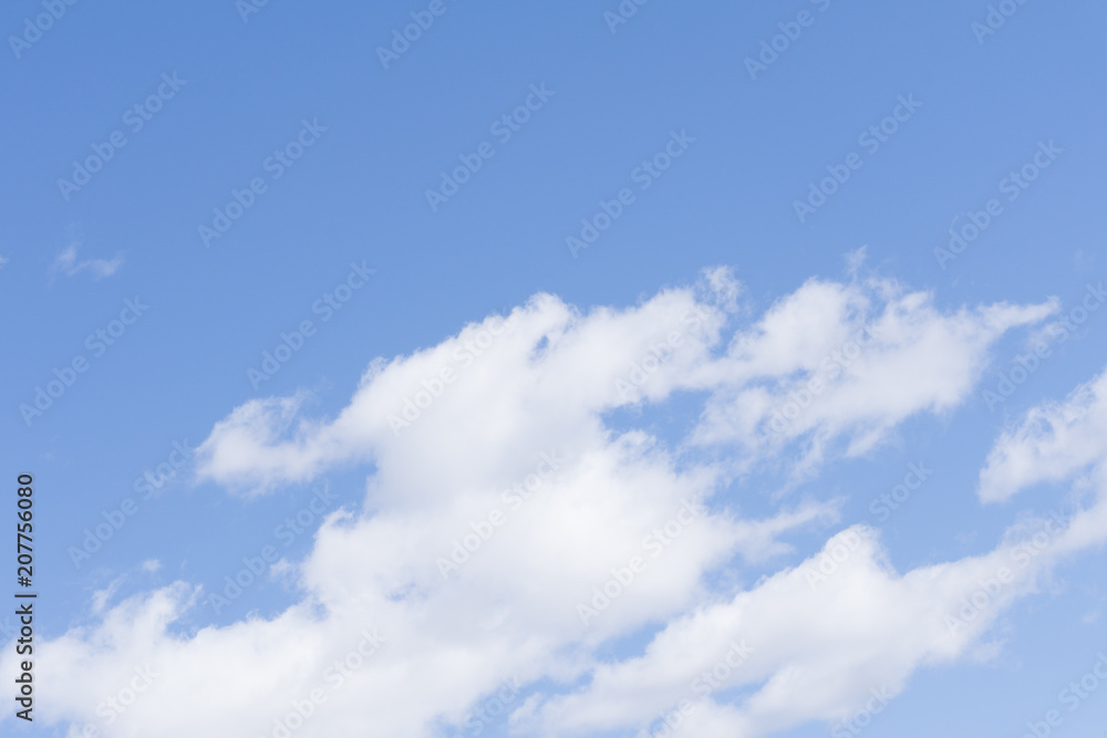 Pale cloudy sky background calm peaceful puffy . Pale cloudy sky background calm peaceful puffy .