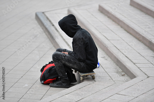 Canvas Print A young homeless man and his skateboard in Quebec-Canada.