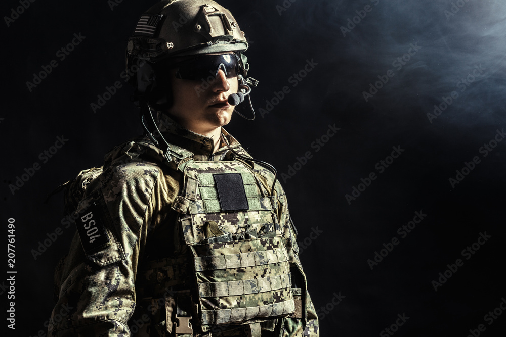 Special forces soldier with rifle on dark background Special forces soldier with rifle on dark background