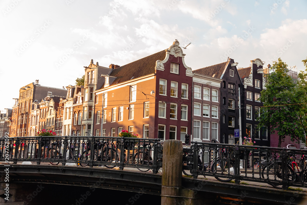 Fototapeta premium sunrise on the streets and canals of amsterdam