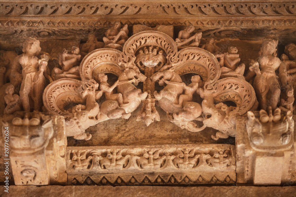 Firedrake, riders on horses, deities and mythical creatures, on a pediment of one of temples in Khajuraho.