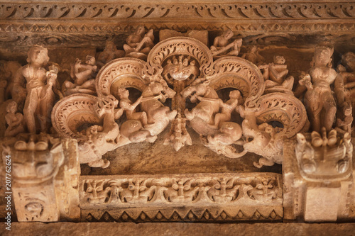Firedrake, riders on horses, deities and mythical creatures, on a pediment of one of temples in Khajuraho.