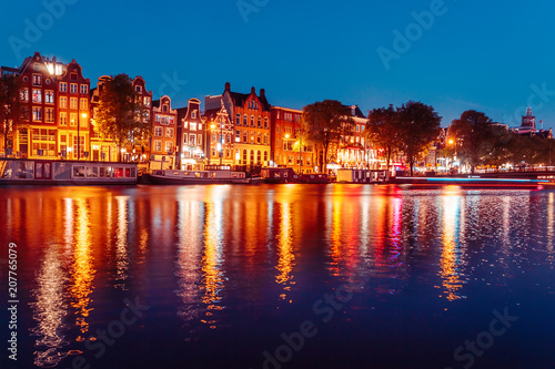 Evening building on the streets and amsterdam channels with illumination