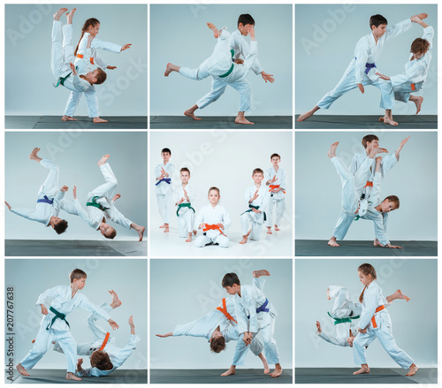 The group of boys and girl fighting at Aikido training in martial arts school. Healthy lifestyle and sports concept