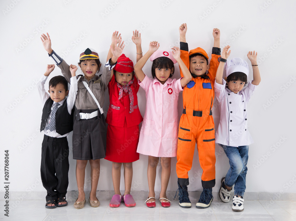 Obraz premium childrens dressed in costumes of different professions