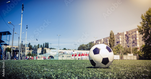Soccer ball on grass in soccer stadium.