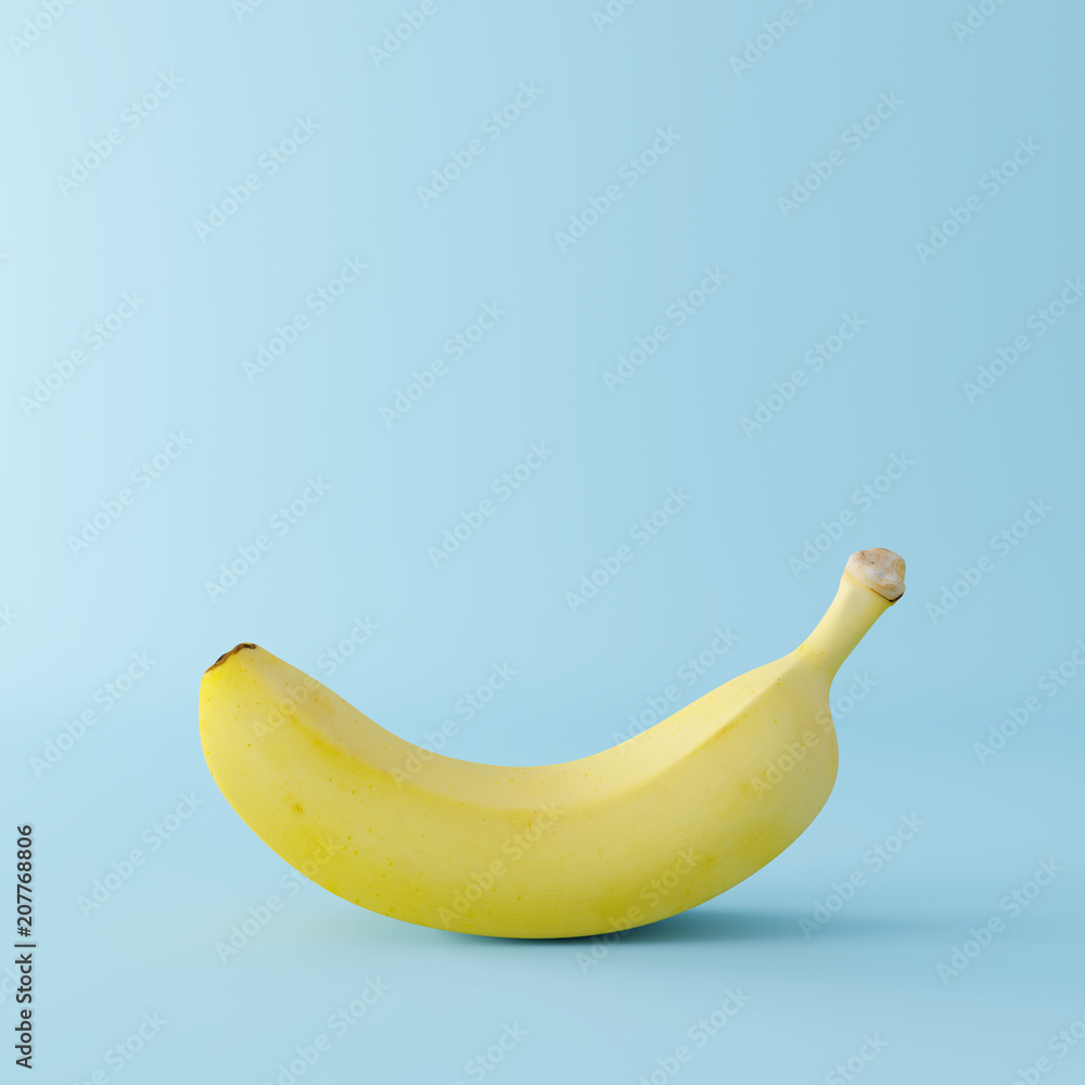 Banana on pastel blue background. minimal concept