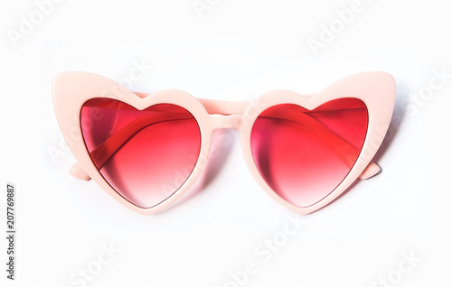 Pink heart shape sunglasses isolated on white background