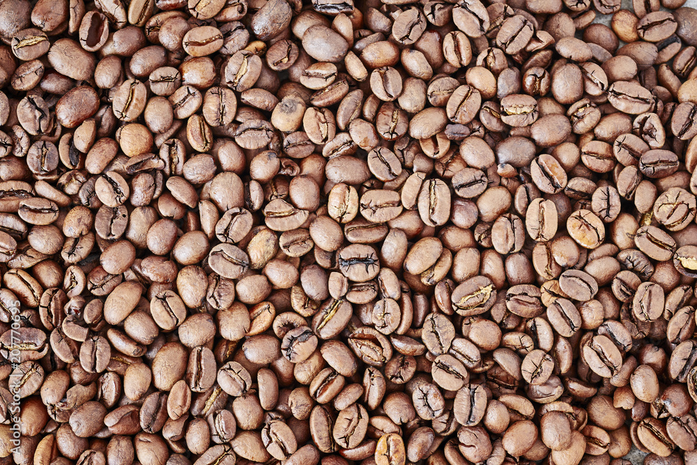 Fototapeta premium Freshly roasted coffee beans background.