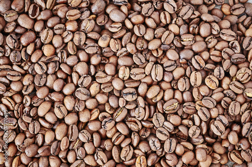 Freshly roasted coffee beans background.