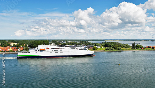Canvas Print Modern ferry enters the port of Rostock