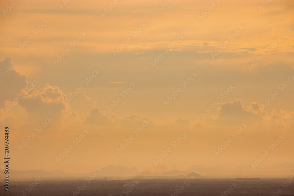 Fototapeta premium Evening weather, Sunset sky, Dark shadow meadow in the field and far away as a mountain.