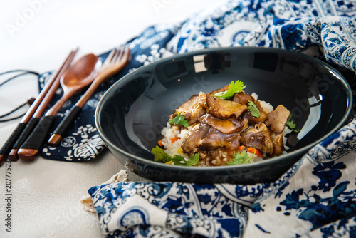 Vietnamese style caramel pork with rice and vegetable photo