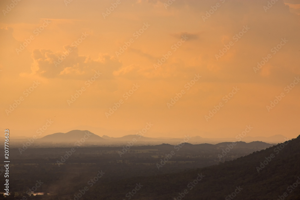 Evening weather, Sunset sky, Dark shadow meadow in the field and far away as a mountain. Evening weather, Sunset sky, Dark shadow meadow in the field and far away as a mountain.