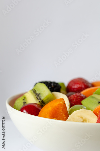 Fresh colorful fruit salad on white background.Healthy nutrition  diet concept.