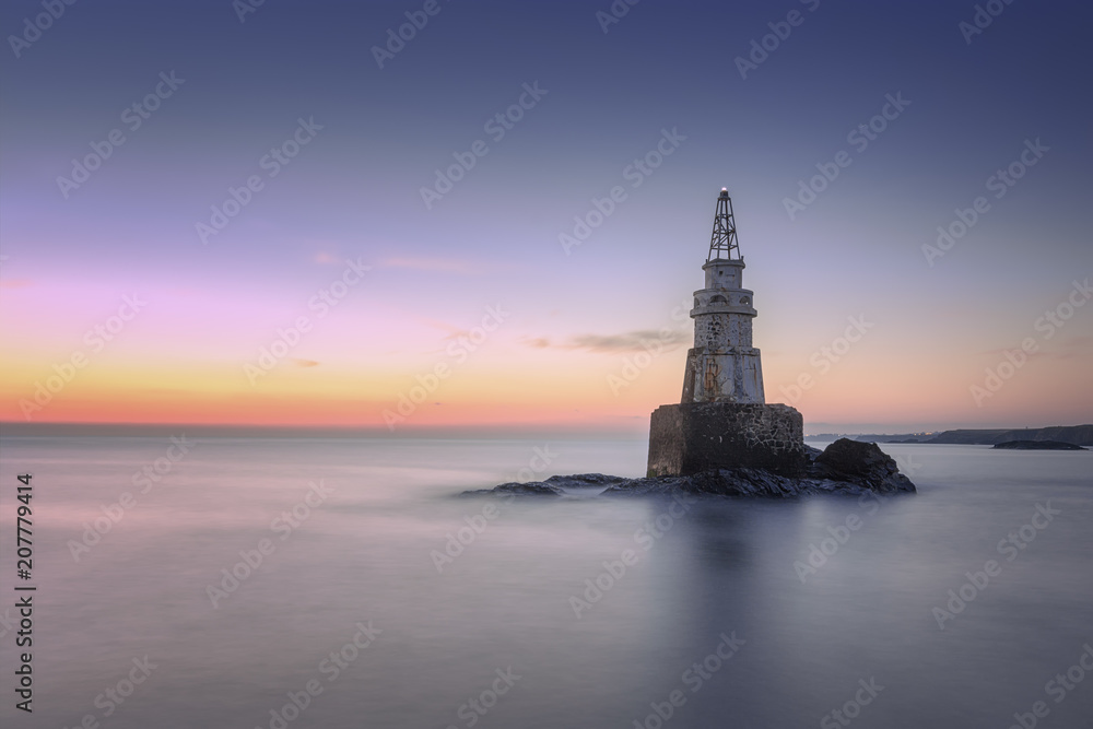 sunrise of the lighthouse in Ahtopol, Bulgaria. Blue hour seascape. Long exposure