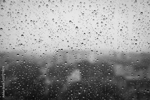 wet glass window  black and white  