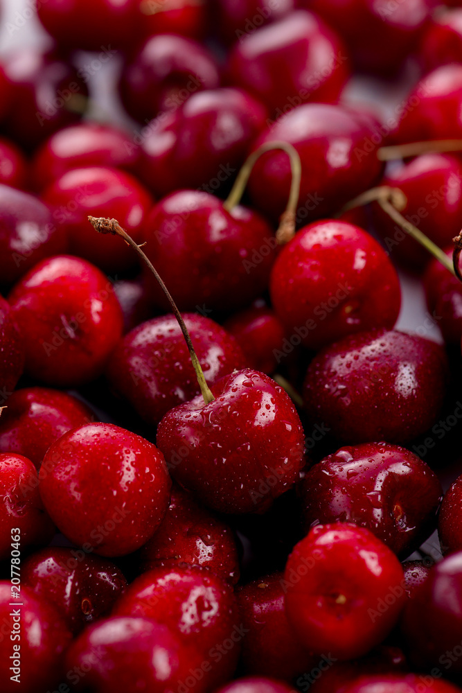 Cherries with water drops close-up. Macro berries shot with copy space Cherries with water drops close-up. Macro berries shot with copy space