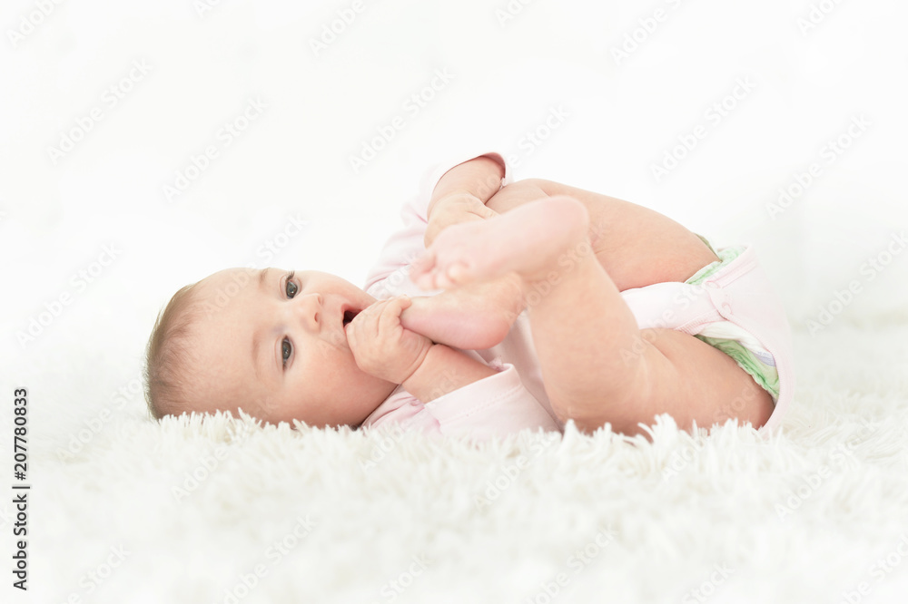 Cute baby girl on white blanket Cute baby girl on white blanket
