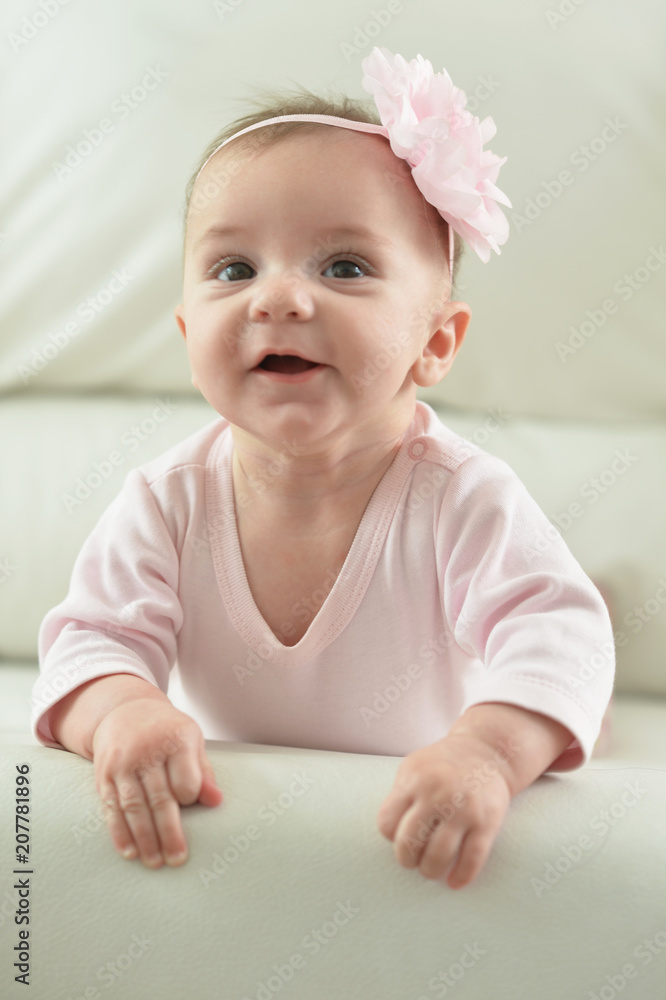 Cute charming girl with a flower on her head Cute charming girl with a flower on her head