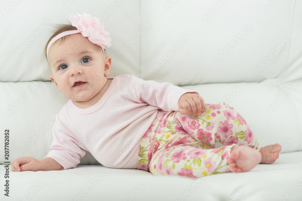 Cute charming girl with a flower on her head Cute charming girl with a flower on her head
