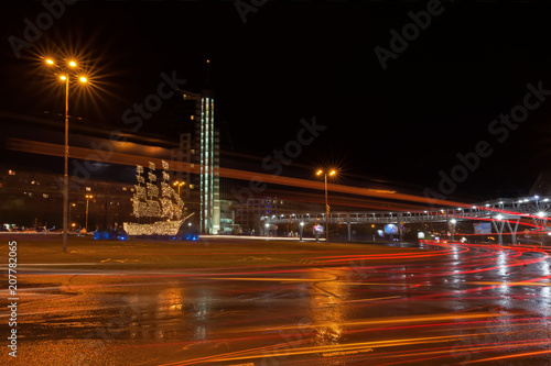 BURGAS, BULGARIA - FEBRUARY 4, 2018: circular motion at the crossroads. Overhead pedestrian bridge at night © petiast