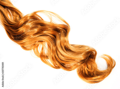 long curly strawberry blond hair isolated on white background