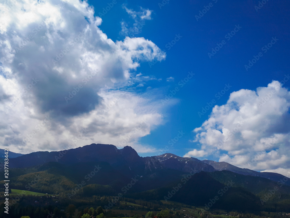 Beautiful blue sky with clouds in the mountains Beautiful blue sky with clouds in the mountains