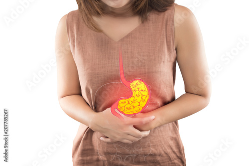 Woman suffering from indigestion or gastric isolated on white background photo