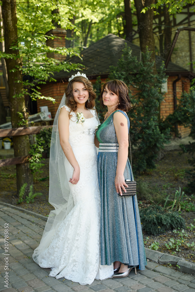 Bride Hugging Mother On Wedding Day