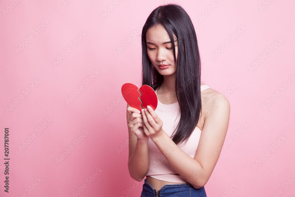 Beautiful young Asian woman with broken heart. Beautiful young Asian woman with broken heart.