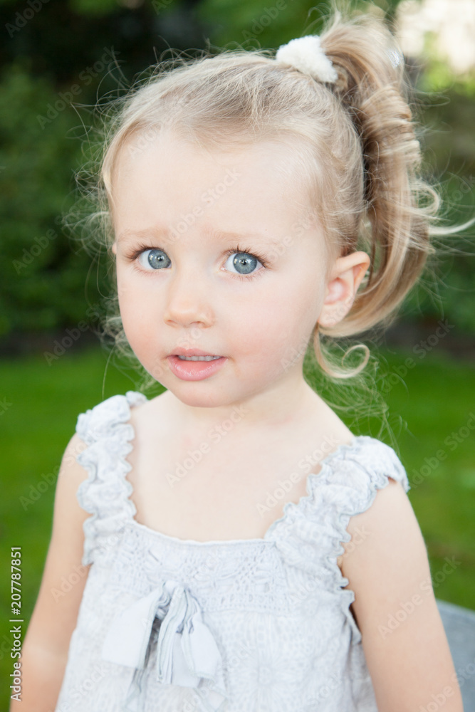 Portrait of little adorable blond girl with blue eyes Portrait of little adorable blond girl with blue eyes