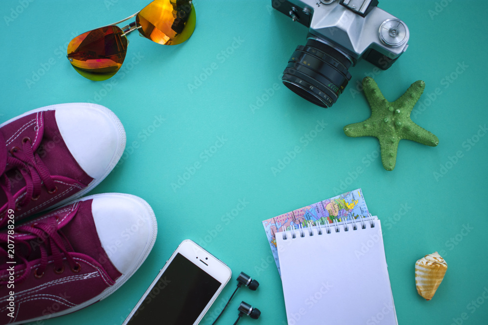 Outfit of traveler on green background with copy space, Travel concept