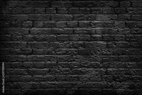 Old black brick wall background.