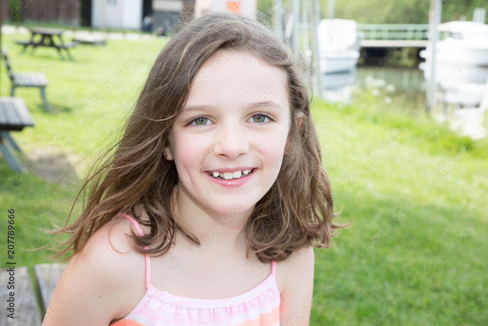 Cute little girl on the meadow in summer day Cute little girl on the meadow in summer day