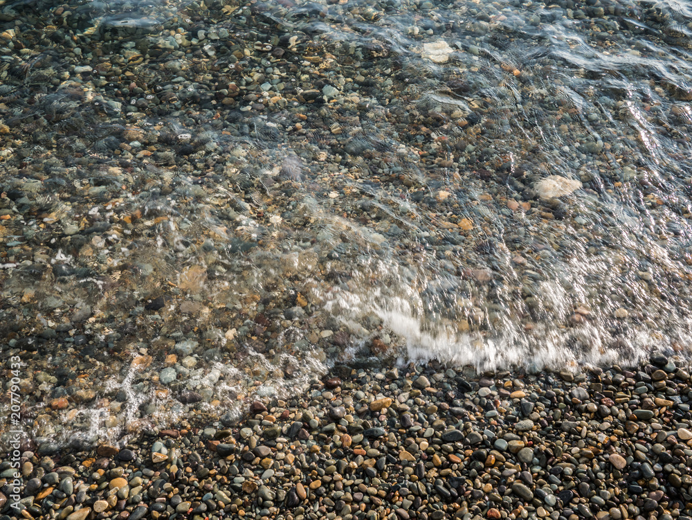 pebble beach and clear surf wave. sea coast pebble beach and clear surf wave. sea coast