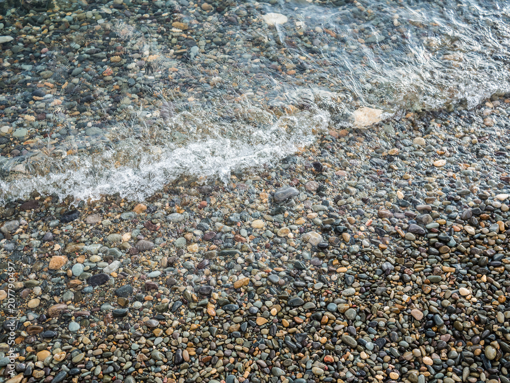pebble beach and clear surf wave. sea coast pebble beach and clear surf wave. sea coast