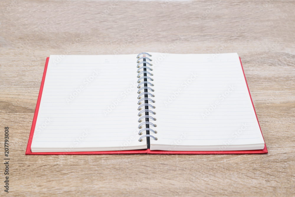 Open diary or note book on wooden table. Open diary or note book on wooden table.