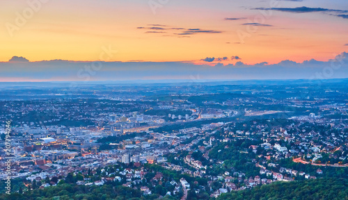 Night falls over Stuttgart City in Germany   Turning on the lights in the city