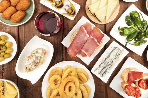 Spanish food. Overhead photo of many different tapas with wine