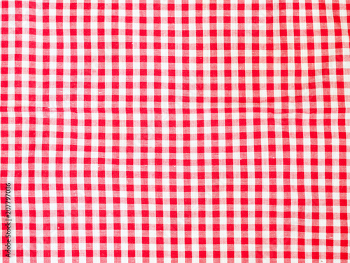 Top view of red and white plaid picnic tablecloth