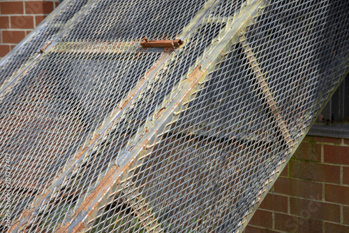Billede på lærred Metal holding cell outside prison cellblock