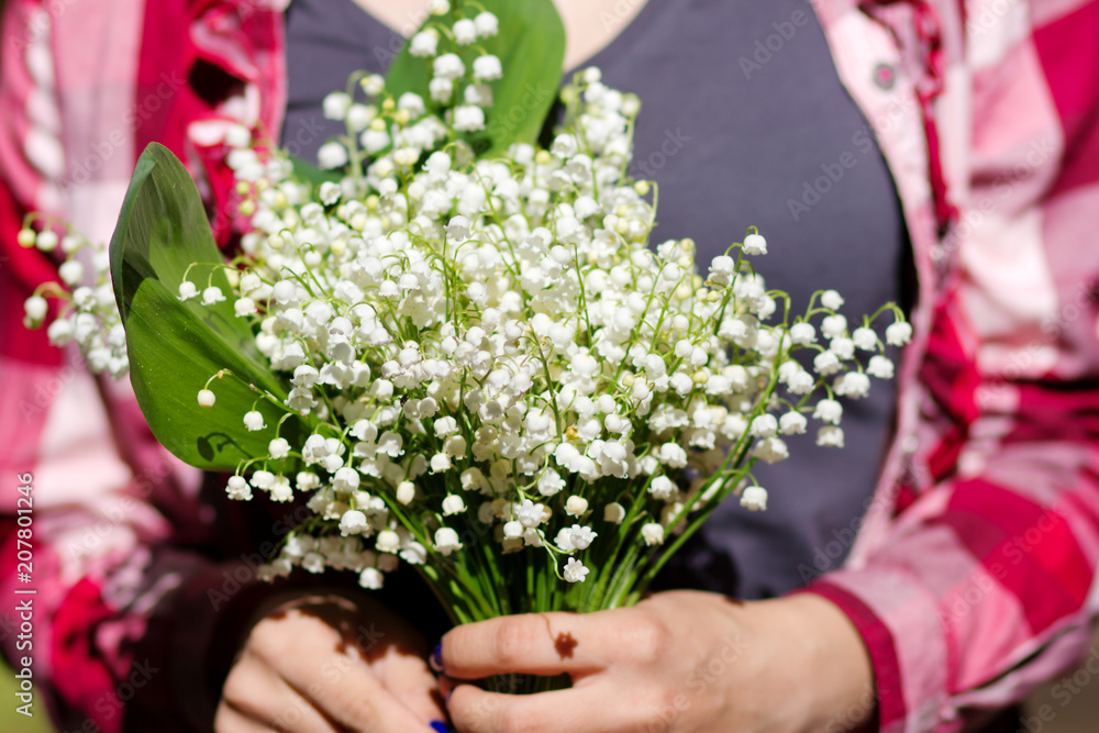 lilies of the valley in the hands of a girl lilies of the valley in the hands of a girl